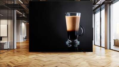 Coffee drink or cocktail with cream on a black background. Wall mural