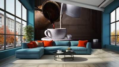 Cup of coffee with milk and sugar on black table Wall mural