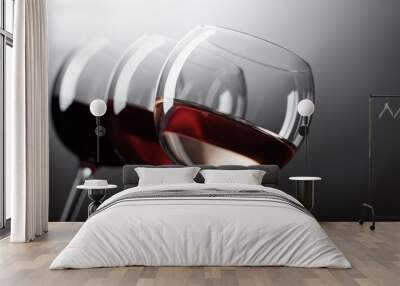 Glasses of  pink , red and white wine . Wall mural