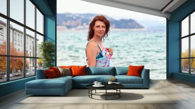 happy woman on Mediterranean coast of Spain Wall mural