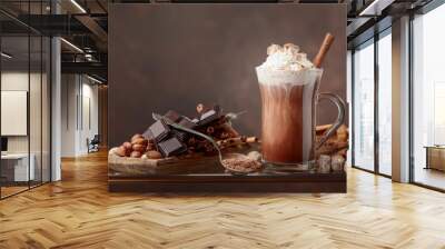 Hot chocolate with cream, cinnamon, chocolate pieces and various spices. Wall mural