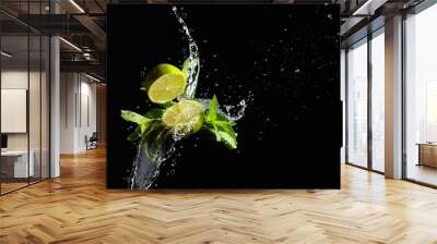 Lime, mint, and water splashes on a black background. Wall mural