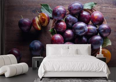 Ripe juicy plums on a wooden background. Wall mural