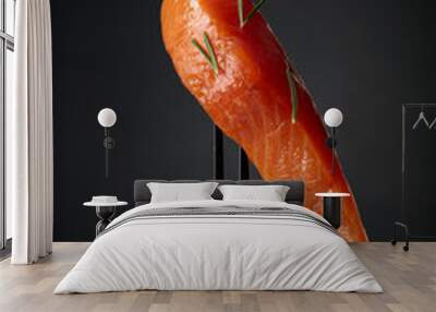 Smocked salmon on a black background. Wall mural