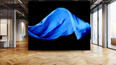 Smooth elegant blue transparent cloth isolated on black background. Wall mural