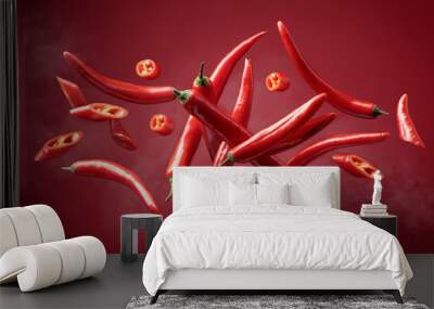 Steaming red pepper in motion on a red background. Wall mural