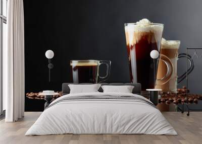 Various coffee drinks on a black background. Wall mural