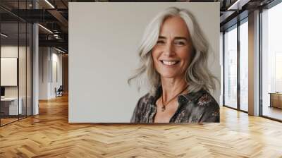 Portrait of a beautiful senior woman with white hair smiling at the camera Wall mural