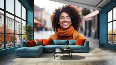 Portrait of a beautiful young afro american woman with afro hairstyle and glasses Wall mural