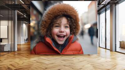 Portrait of a cute little boy wearing a fur hat in the city Wall mural