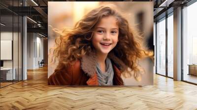 Portrait of a cute little girl with curly hair in the city Wall mural