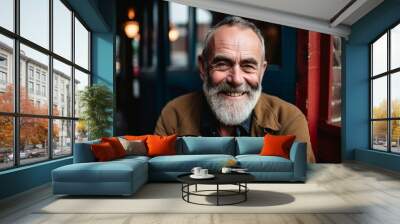 Portrait of a happy senior man smiling at the camera in a pub Wall mural