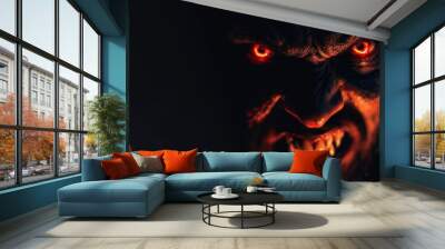 portrait of an angry demonic devil with red glowing eyes and open mouth on black background Wall mural