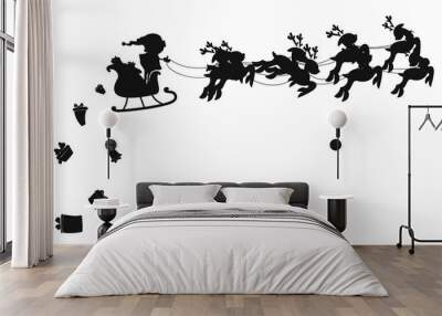 Santa flying in a sleigh with reindeer. Vector illustration. Isolated object. Black silhouette. Santa Claus gives out gifts. Wall mural