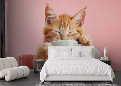 sleepy cute cat, holding cup of coffee Wall mural