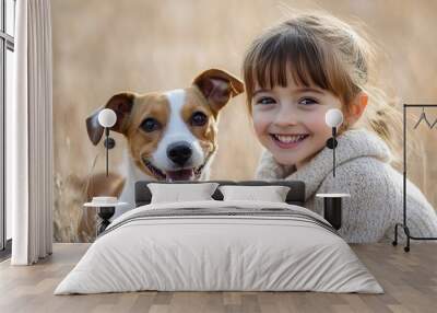 Smiling girl with happy dog in golden field Wall mural