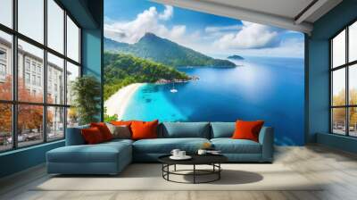 A beautiful beach with turquoise waters surrounded by lush green hills and blue skies with clouds. Wall mural