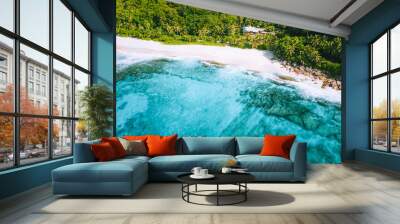 Aerial photo of bizarre paradise tropical beach Anse Bazarca at Mahe island, Seychelles. White sand, turquoise water, palm trees, granite rocks Wall mural