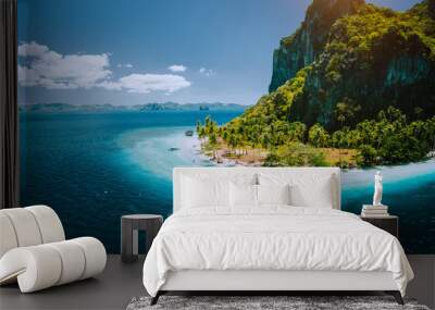 Epic aerial drone panoramic picture of tourist boats arriving tropical Pinagbuyutan Island with idyllic ipil beach surrounded by turquoise blue ocean water. El Nido, Palawan, Philippines Wall mural