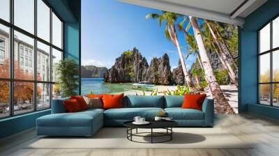 Hidden beach with first tourist trip boats in morning sun light at El Nido, Palawan, Philippines Wall mural