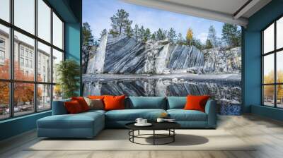 Italian quarry with smooth sections of marble in the Ruskeala Mountain Park on a sunny summer day Wall mural