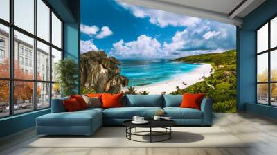 Panoramic view of beautiful Grand Anse beach on La Digue island in Seychelles. Blue lagoon with white clouds above Wall mural