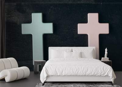 Two Christian cross on a textured black background. Religion concept. Male Female Wall mural