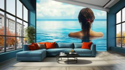 Woman enjoying serene ocean view from infinity pool Wall mural