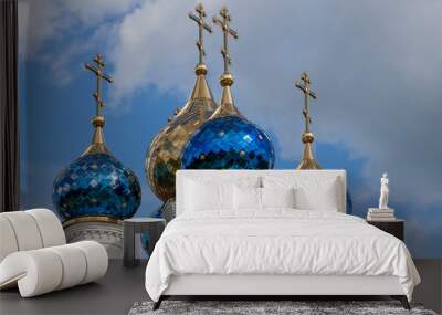 Unusual domes of the white-stone Orthodox Church, covered with colored shiny plates Wall mural