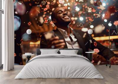 young african man sitting at casino table with many poker chips flying around and drink, black male gambling and winning, looking confident and handsome, gamble establishment concept Wall mural