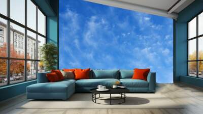 blue beautiful sky with snow-white clouds of different shapes, background Wall mural