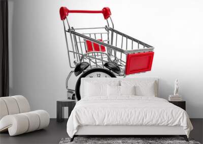 Alarm clock with shopping cart on white background. Time to shopping. Wall mural