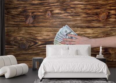 hand with money on the table Wall mural