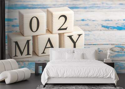 may 2nd. wooden cubes with date of 2 may on old blue wooden background. Wall mural