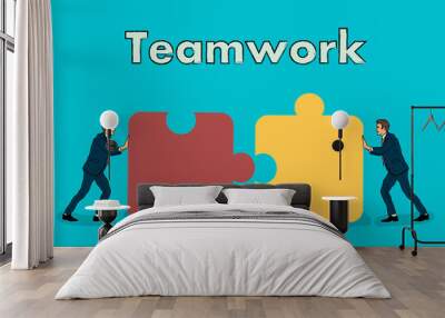 Teamwork. two businessmen connect the two parts of the puzzle into one Wall mural