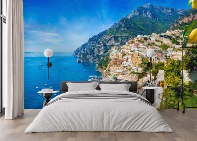 Panoramic view of Positano with comfortable beaches and blue sea on Amalfi Coast in Campania, Italy. Amalfi coast is popular travel and holyday destination in Europe. Wall mural