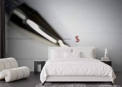 pen lies on a document or notebook, two blank graphs and dollar and Euro signs Wall mural