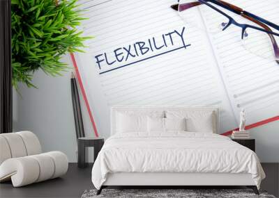 Business flexibility concept. Copy space. Flexibility symbol. Concept word Flexibility in the business notebook Wall mural