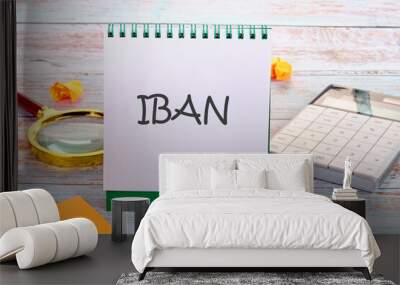 IBAN International Bank Account Number SWIFT Concept. IBAN in an upright notebook in a composition with office supplies Wall mural