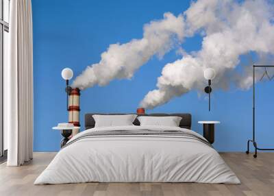 two huge steaming plant power plant tubes over blue sky Wall mural