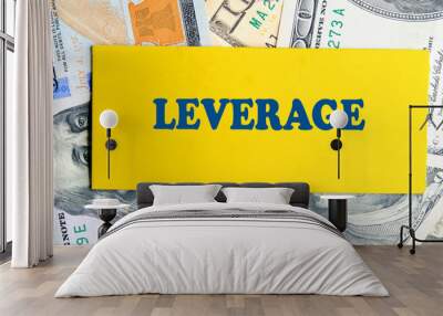 LEVERAGE text written on yellow paper against the background of American dollar bills Wall mural