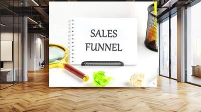 The concept of the info business. The text of the SALES FUNNEL is written in a notebook on a white background Wall mural