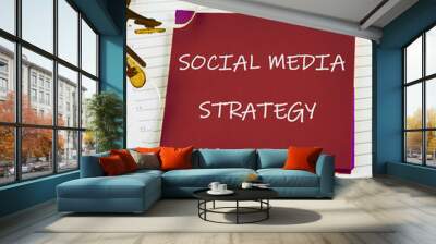 The concept of the info business. The text of the SOCIAL MEDIA STRATEGY is written on a red sticker on a light background Wall mural