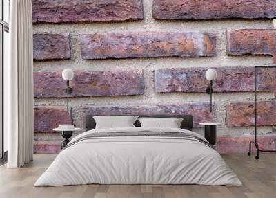 The red brick wall is laid out by hand. The concept of backgrounds Wall mural