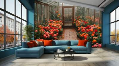 Colorful blooms brighten the interior of a quaint greenhouse during a peaceful afternoon Wall mural