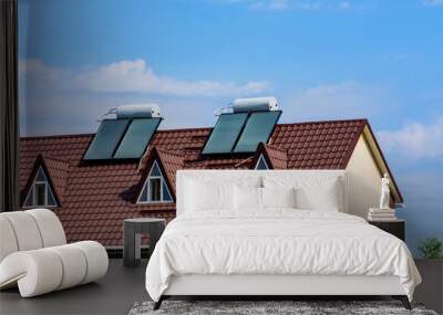 Solar water heaters on roof of the residential house. Clean energy. Ecological concept Wall mural