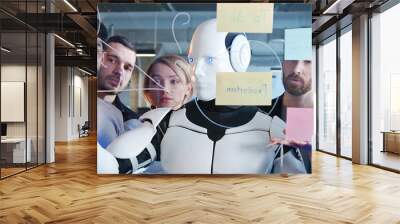 Diverse team of project discussing plans and to-do notes with robot. Teambuilding of multiethnic colleagues. Coworkers brainstorming together with humanoid. Management strategy. Digital transformation Wall mural