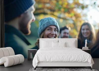 Group of friends having fun in the park on an autumn day. Wall mural