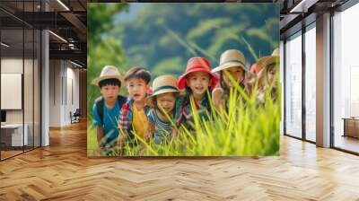 Group of happy children playing in the rice field with nature background. Wall mural