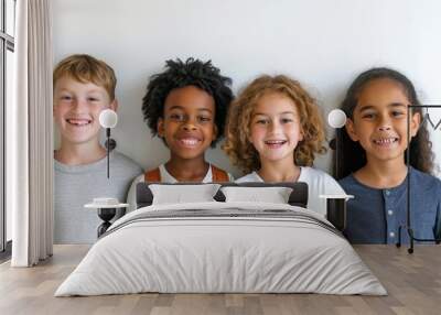 Group of happy children smiling and looking at the camera on white background Wall mural